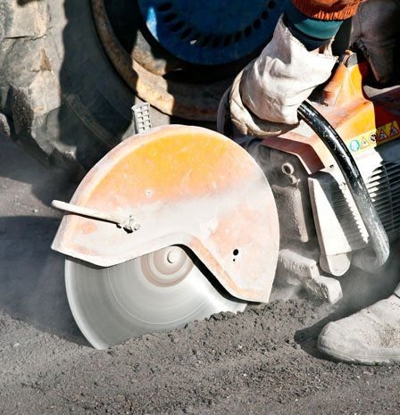 Man cutting an asphalt patch in South Florida