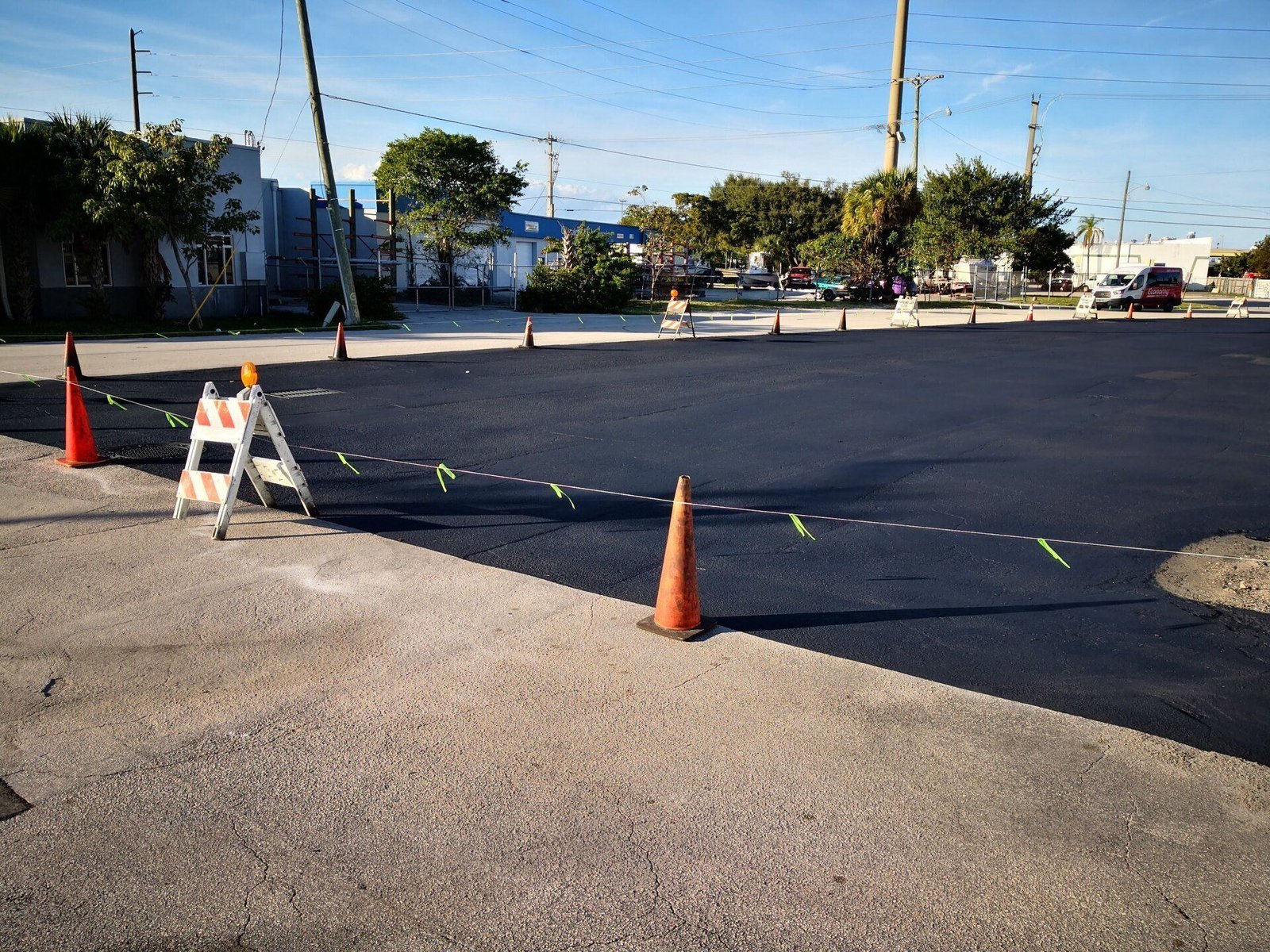 The asphalt parking lot is resurfaced to help extend the life of the space