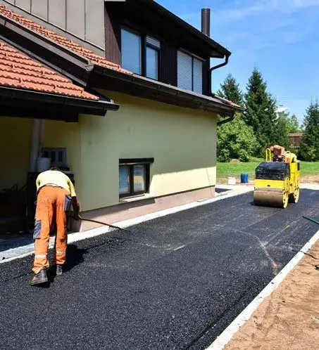 new driveway being installed by asphalt contractors in south florida